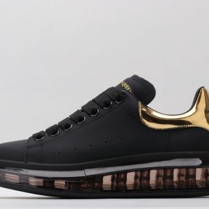 ALEXANDER MCQUEEN black oversized sneakers with gold heel