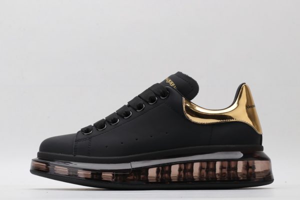 ALEXANDER MCQUEEN black oversized sneakers with gold heel