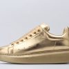 ALEXANDER MCQUEEN Gold oversized sneakers